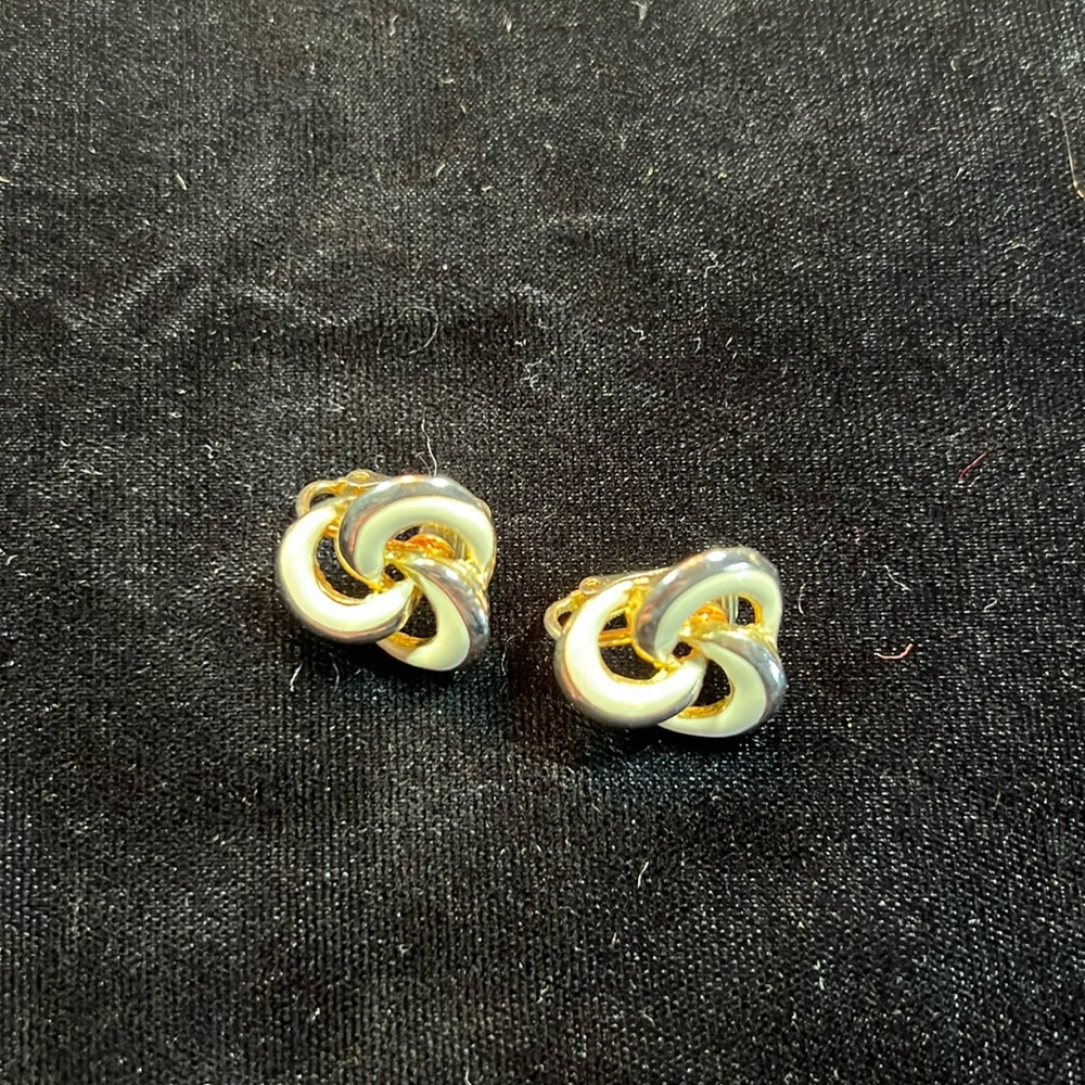 Gold tone and white swirl earrings
